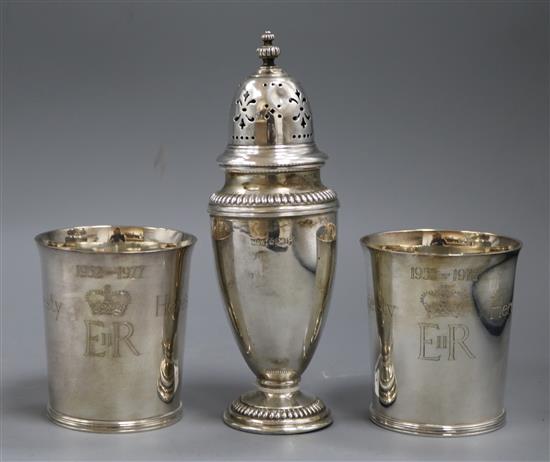 A pair of Tessiers Silver Jubilee beakers and a silver sugar caster,